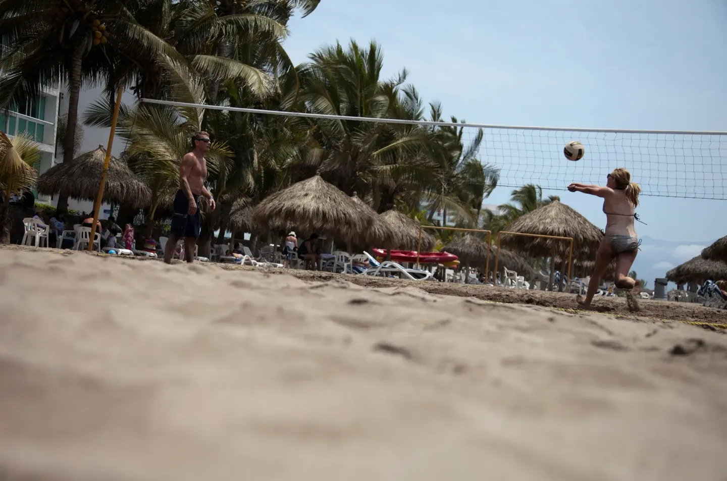 Guests play beach volleyball on the sand at Villa Varadero.