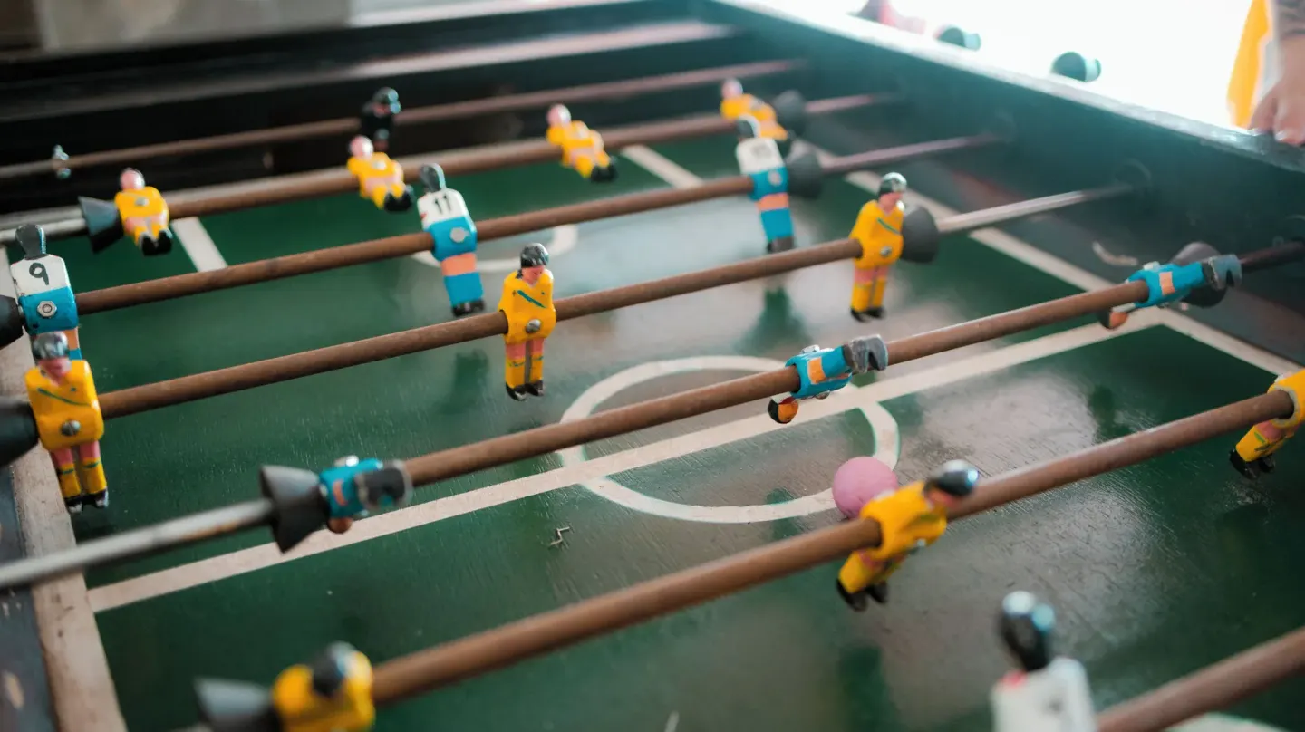 A foosball table with yellow and blue players is shown at Villa Varadero.