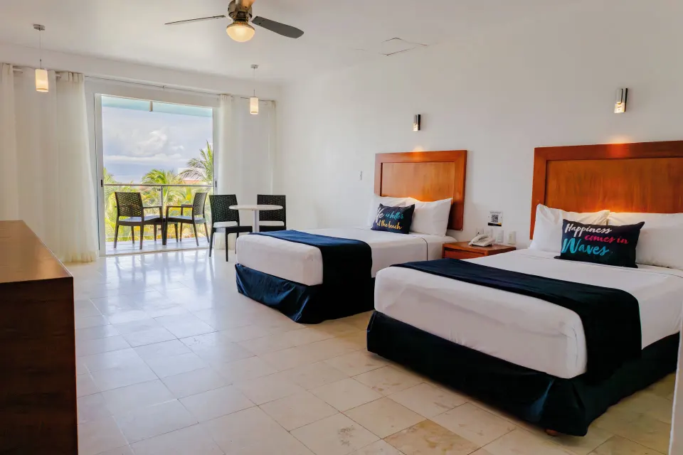Annex Building room with two beds and balcony seating at Villa Varadero.