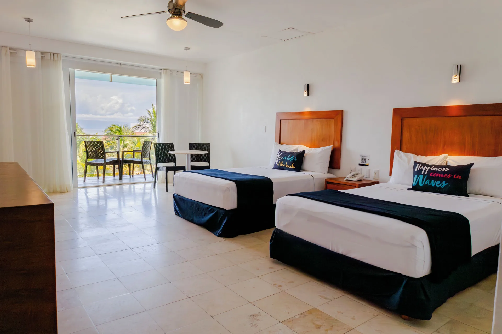 Annex Building room with two beds and balcony seating at Villa Varadero.