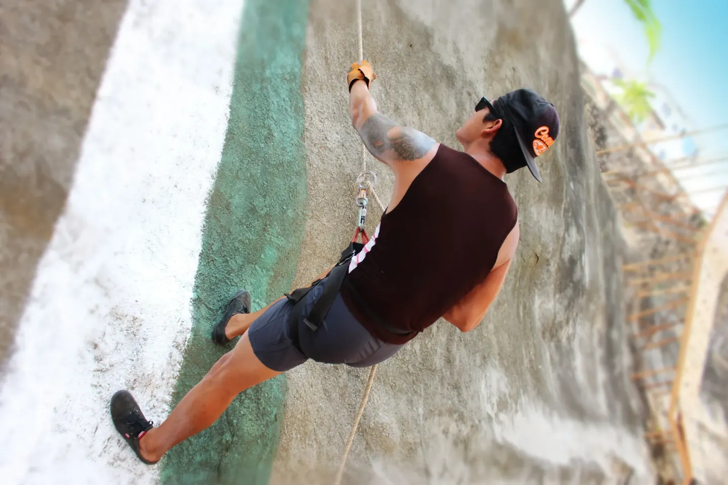Guest rappelling down an outdoor wall at Vista Playa de Oro Manzanillo.