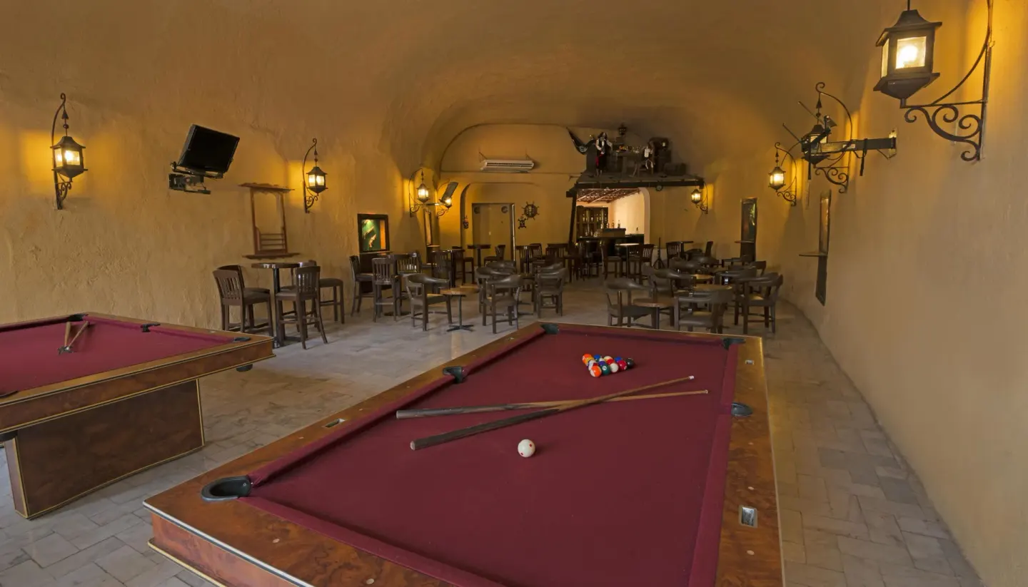 Pool tables and tavern seating inside Barba Negra at Vista Playa de Oro Manzanillo.