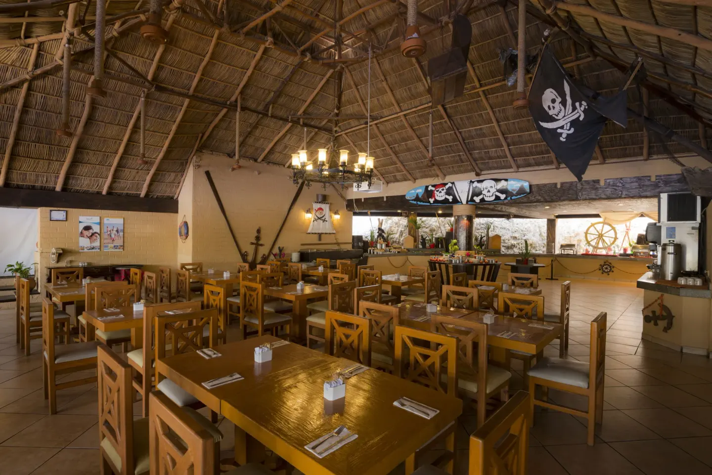 Pirate-themed buffet dining room with wooden tables at Vista Playa de Oro Manzanillo.