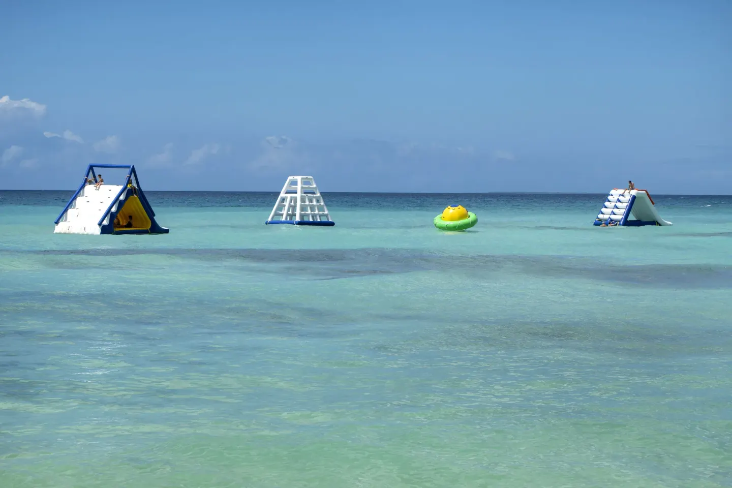 Floating water playgrounds sit in the turquoise sea off Viva Dominicus Palace.