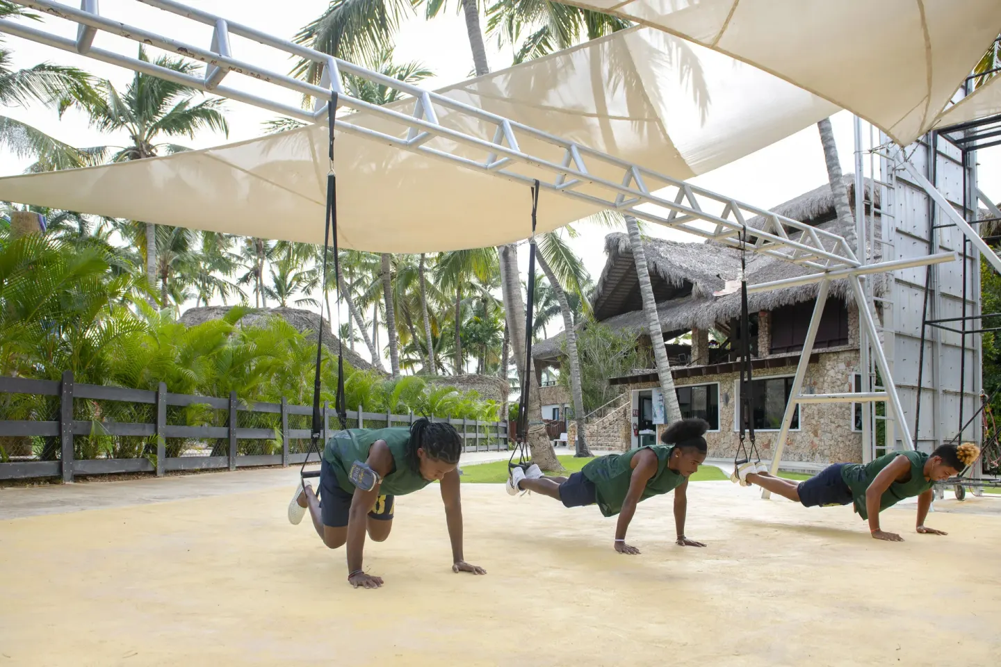 Outdoor fitness class under shade sails at Viva Dominicus Palace.