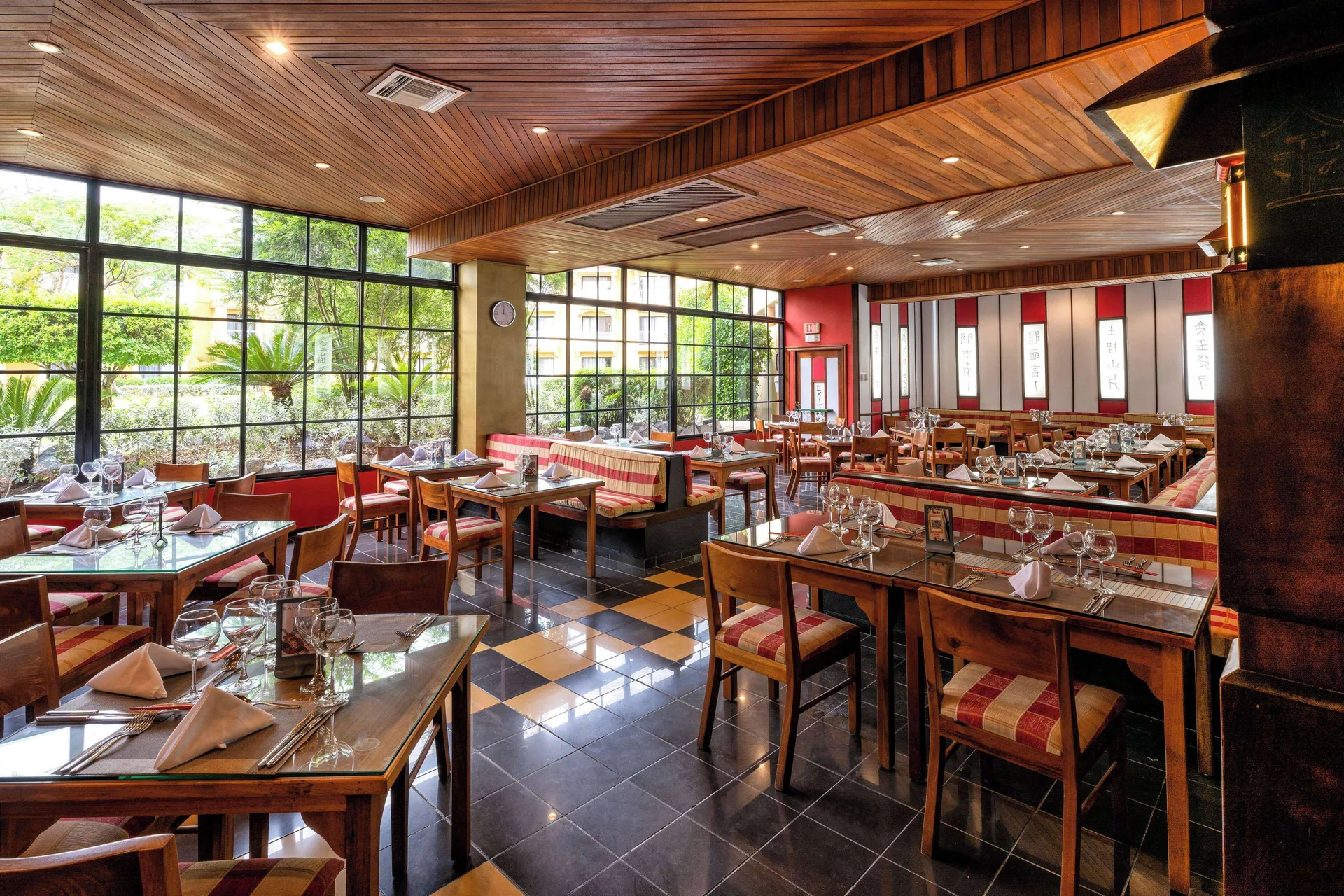 Asian-style restaurant dining room with wood ceiling at Viva Dominicus Palace.