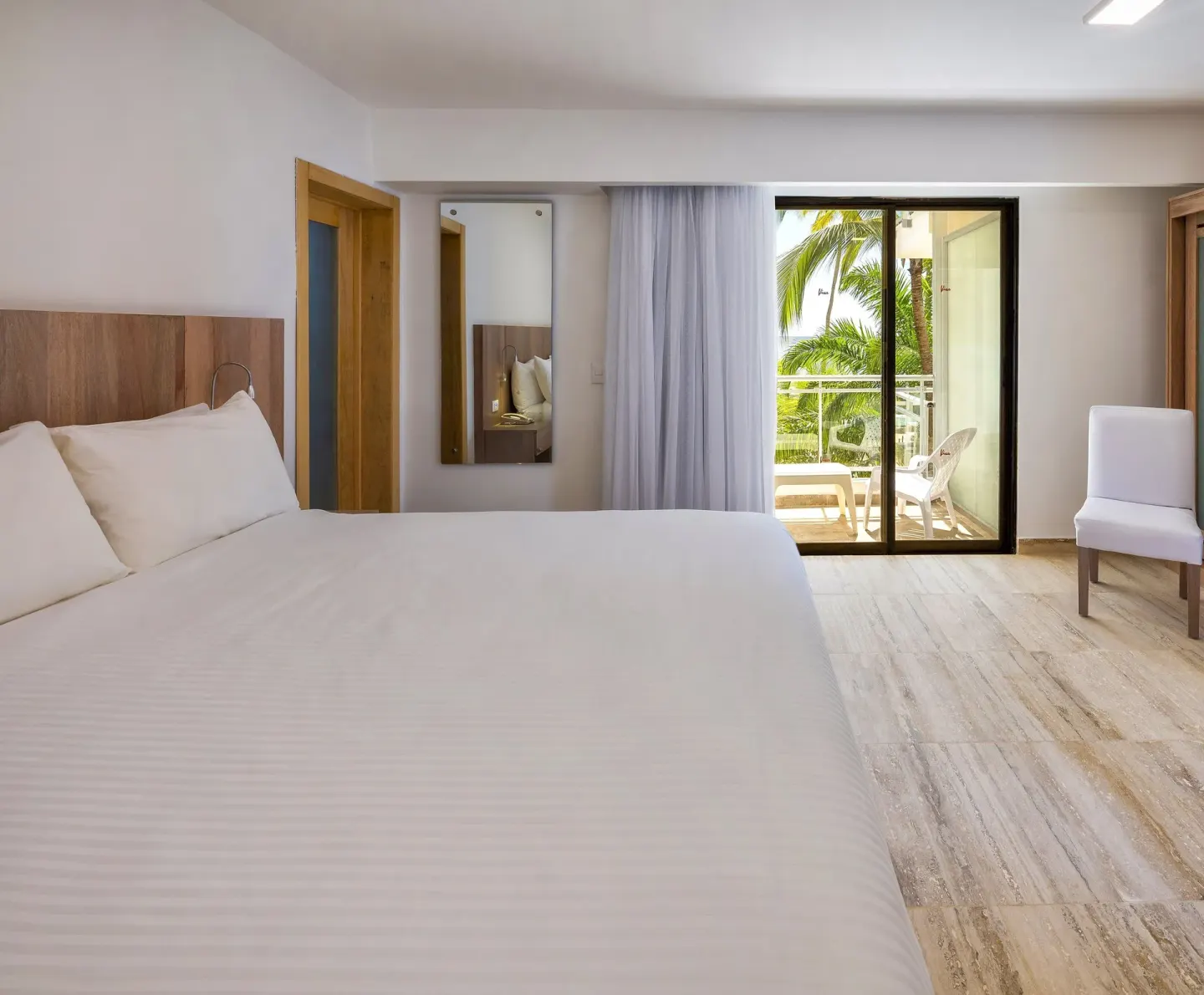 Superior Ocean View king room with palm-lined balcony at Viva Dominicus Palace.
