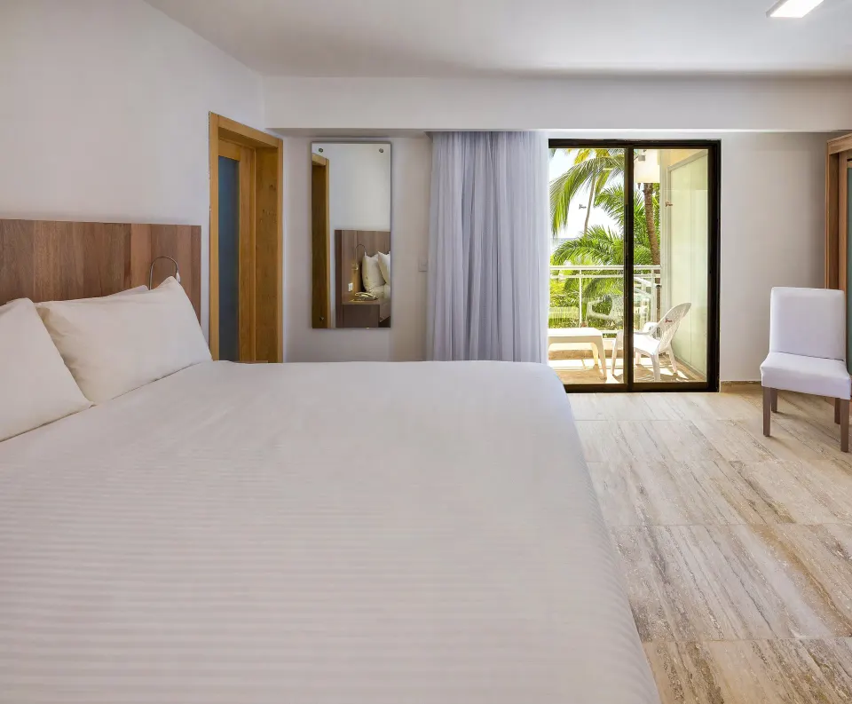 Superior Ocean View king room with palm-lined balcony at Viva Dominicus Palace.
