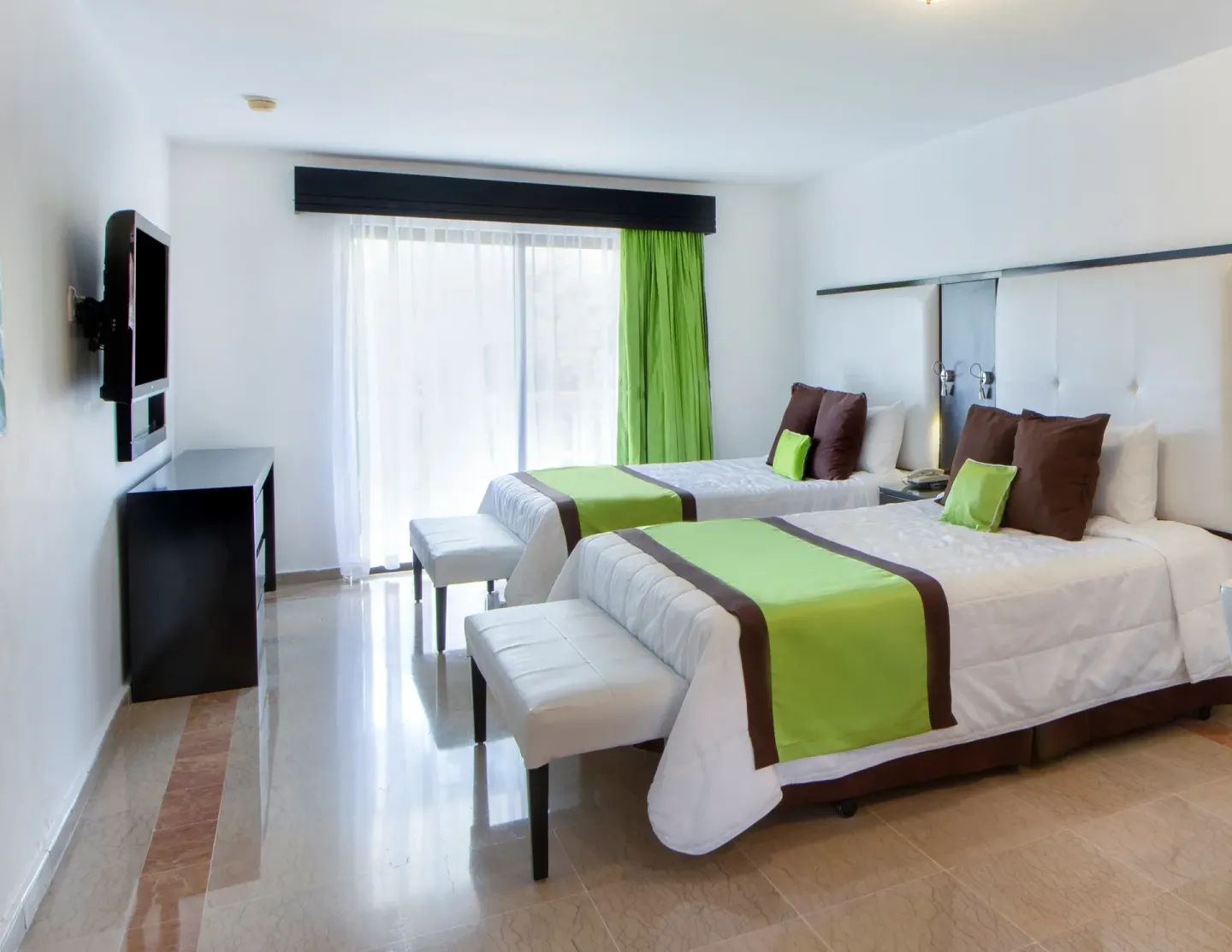 Superior Ocean View room with two beds and wall-mounted TV at Viva Dominicus Palace.