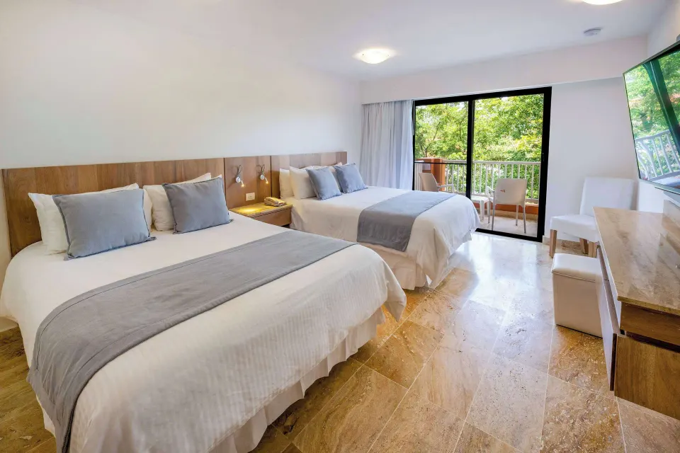 Superior Plus two-bed room with balcony and garden view at Viva Dominicus Palace.