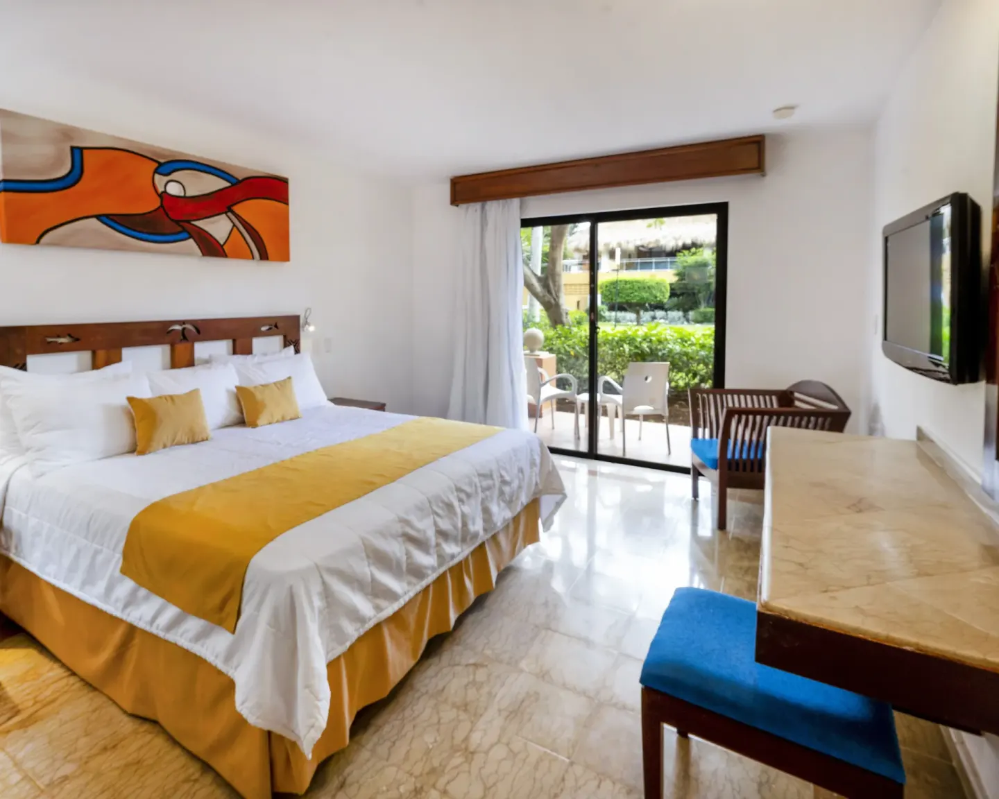 Superior non-smoking king room with TV and furnished patio at Viva Dominicus Palace.