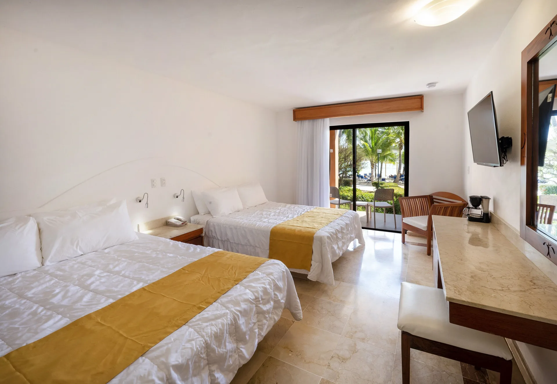 Superior non-smoking room with two beds and counter area at Viva Dominicus Palace.