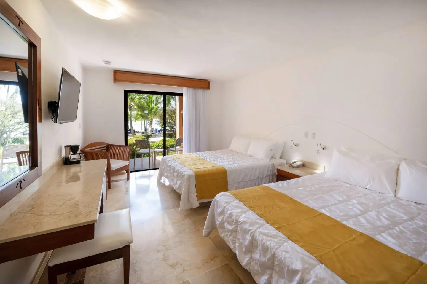 Superior non-smoking room with two beds, desk, and garden patio at Viva Dominicus Palace.