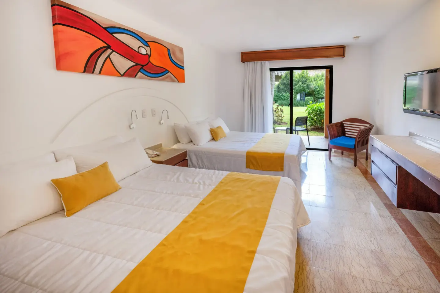 Superior non-smoking room with two beds and garden-facing doors at Viva Dominicus Palace.