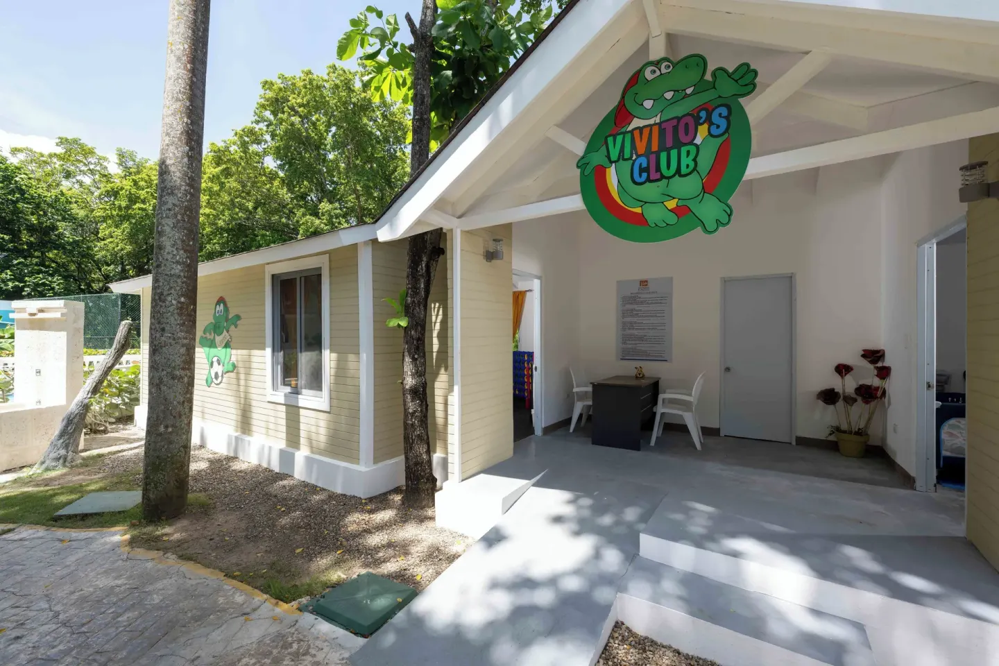 Kids club exterior with shaded entry and cartoon signage at Viva Heavens.