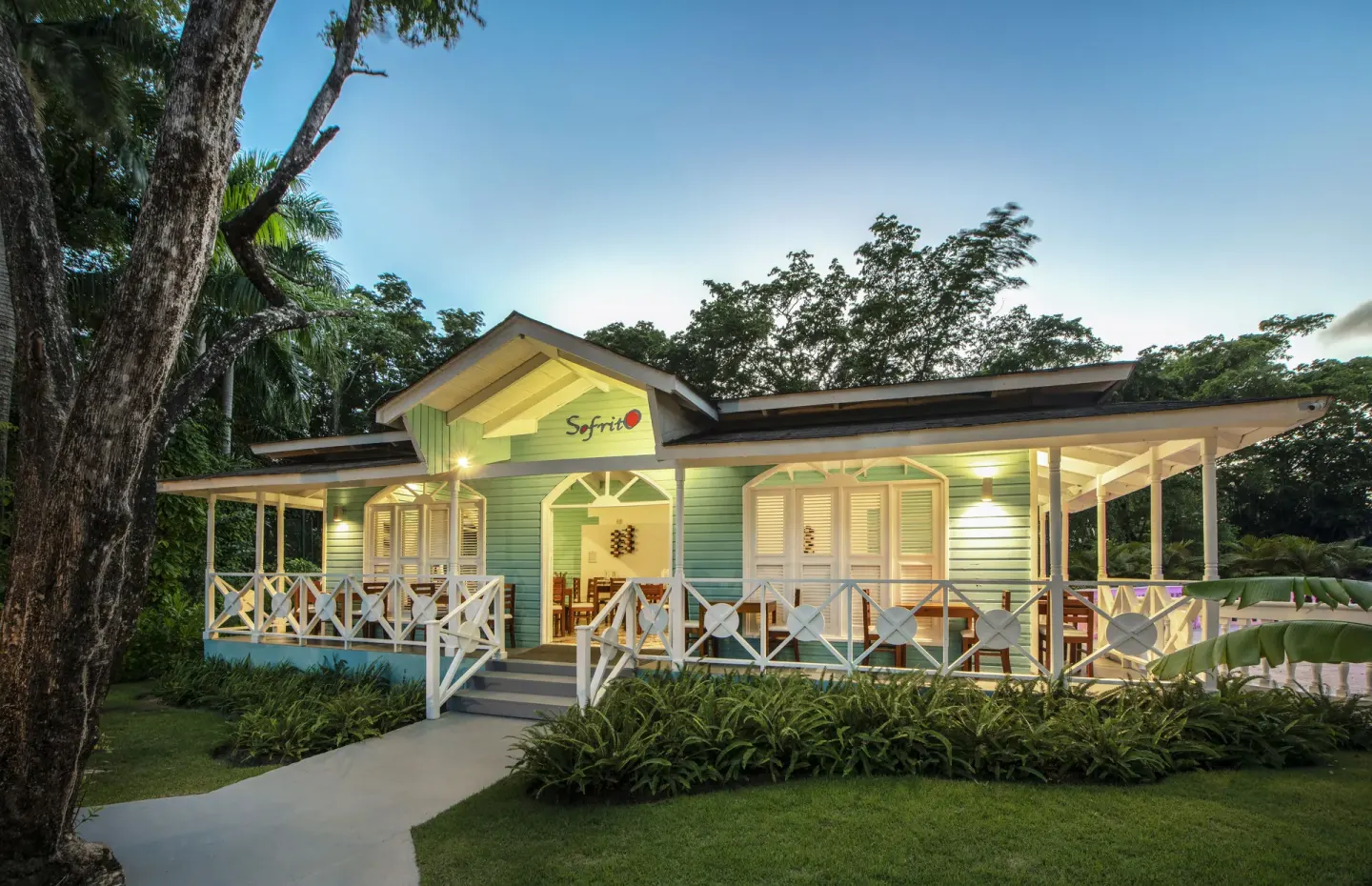 Sofrito restaurant exterior with veranda and garden at Viva Heavens.