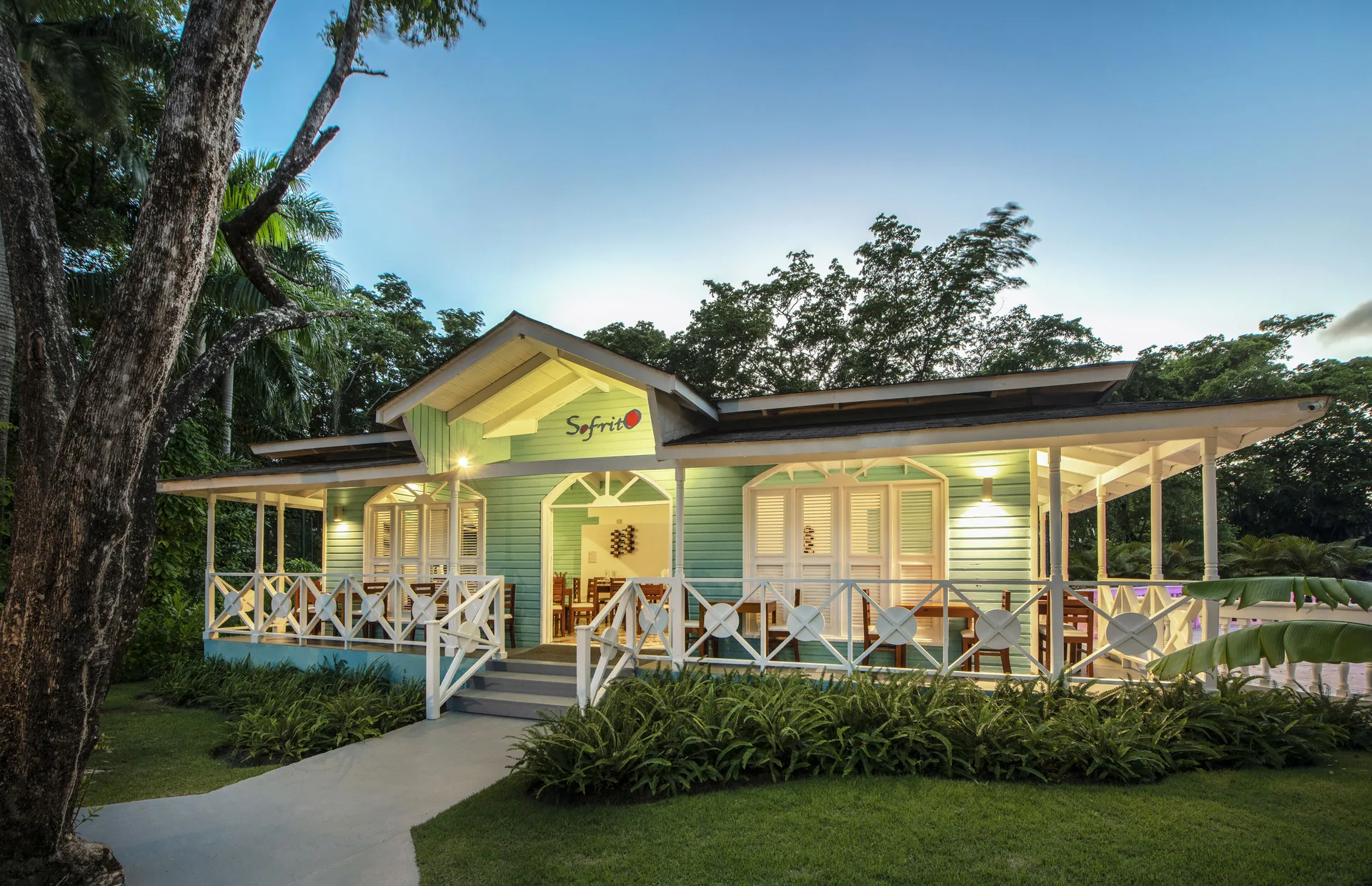 Sofrito restaurant exterior with veranda and garden at Viva Heavens.