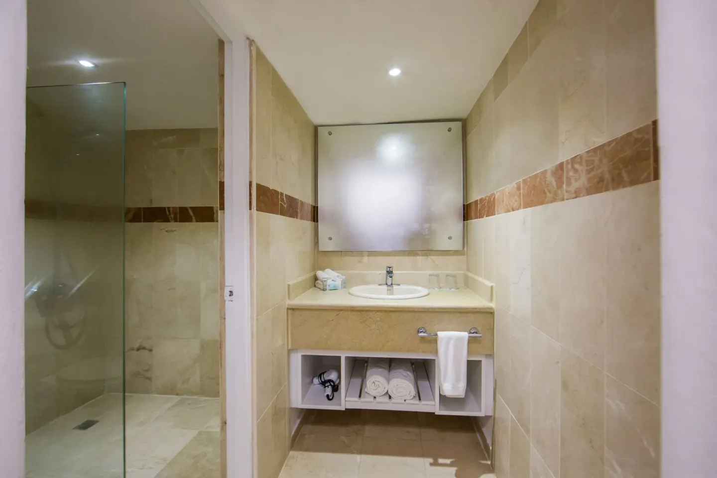 All Together Non-Smoking bathroom with vanity and glass shower at Viva Heavens.