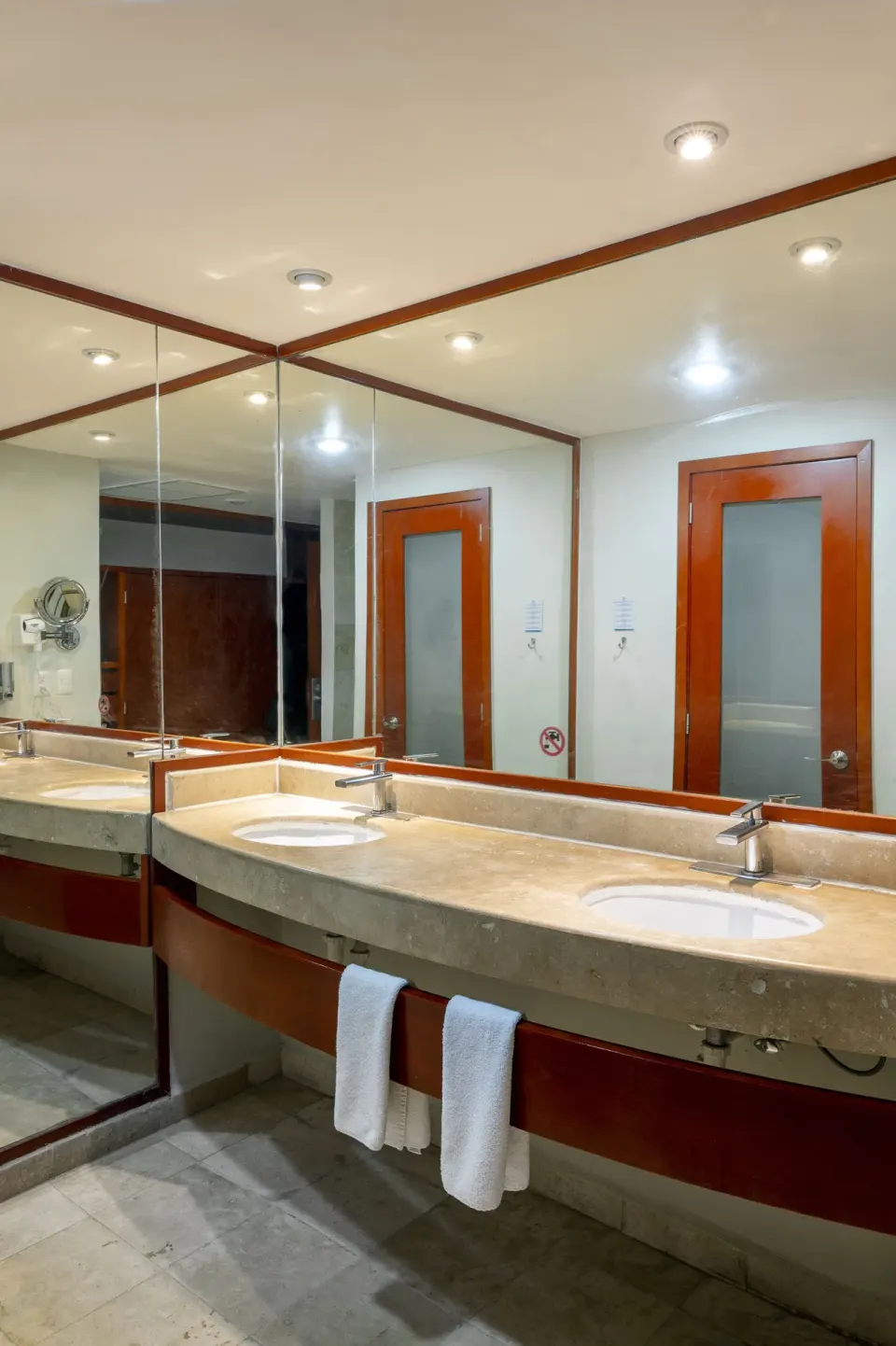 Bathroom vanity with double sinks and large mirror at Viva Maya