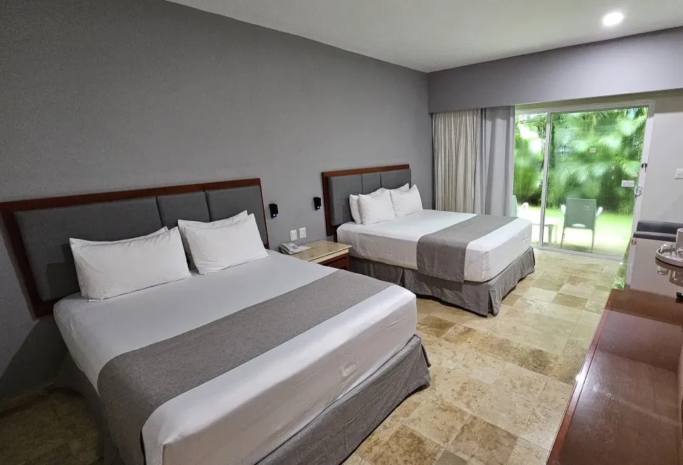 Diagonal view of Viva Maya with two beds and nightstand