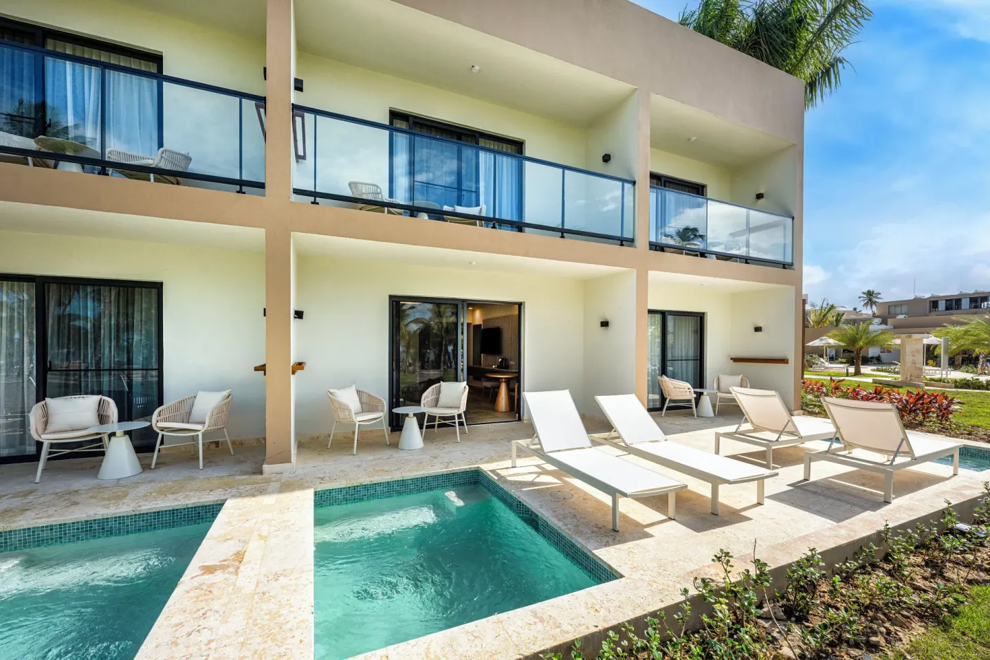 Ground-floor terraces with plunge pools and loungers at Viva Miches.