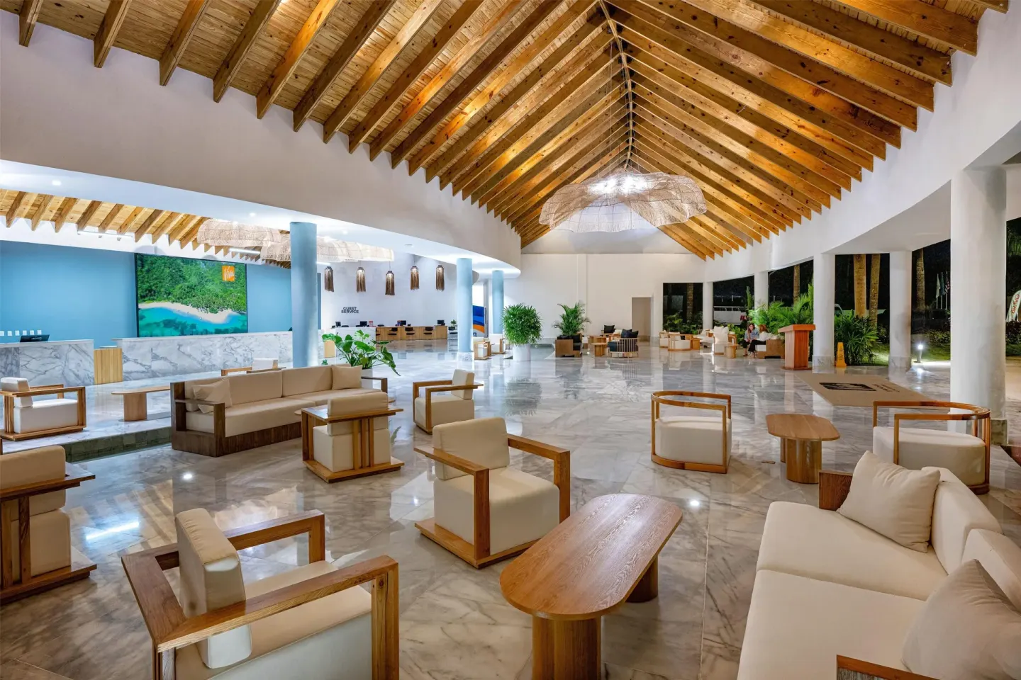Spacious lobby with reception area and lounge seating at Viva Miches.