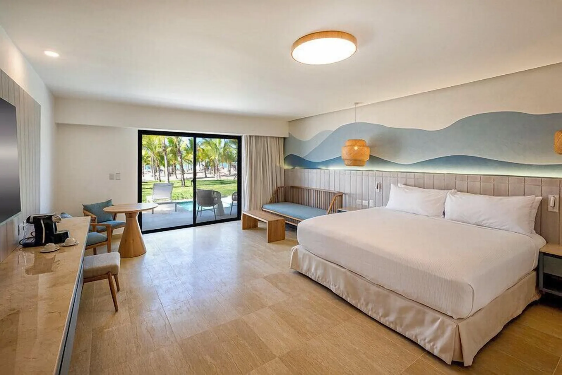 Splash Room with one visible king bed and patio view at Viva Miches.