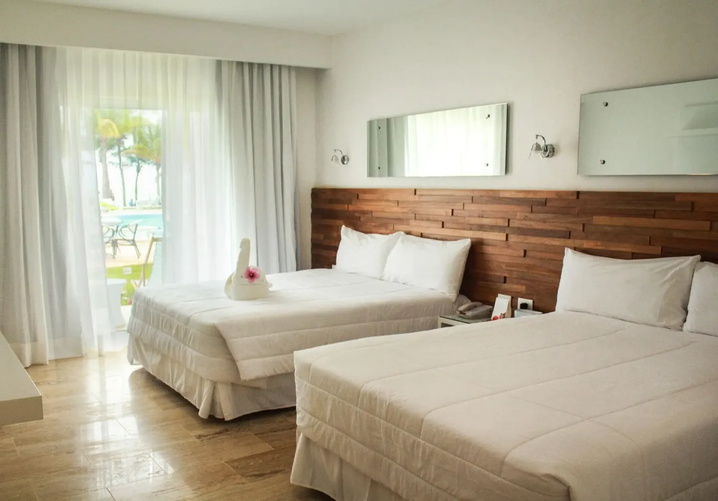 Superior Ocean View Room with two beds and balcony light at Viva Tangerine.