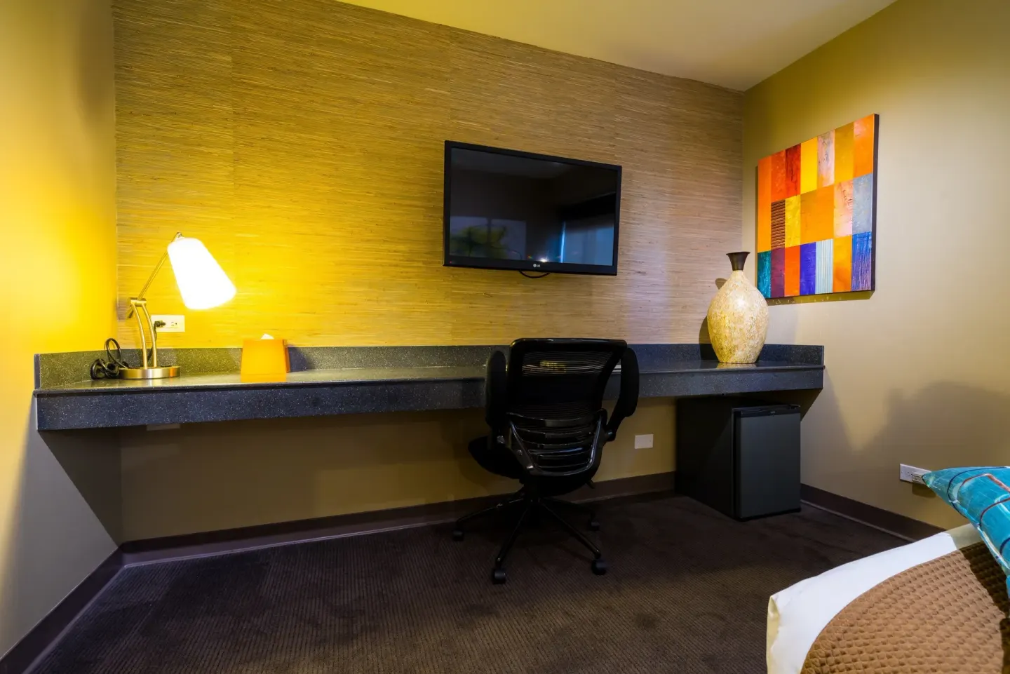 Desk area in a Lifestyle Family Suite City View room at Vive Hotel Waikiki.