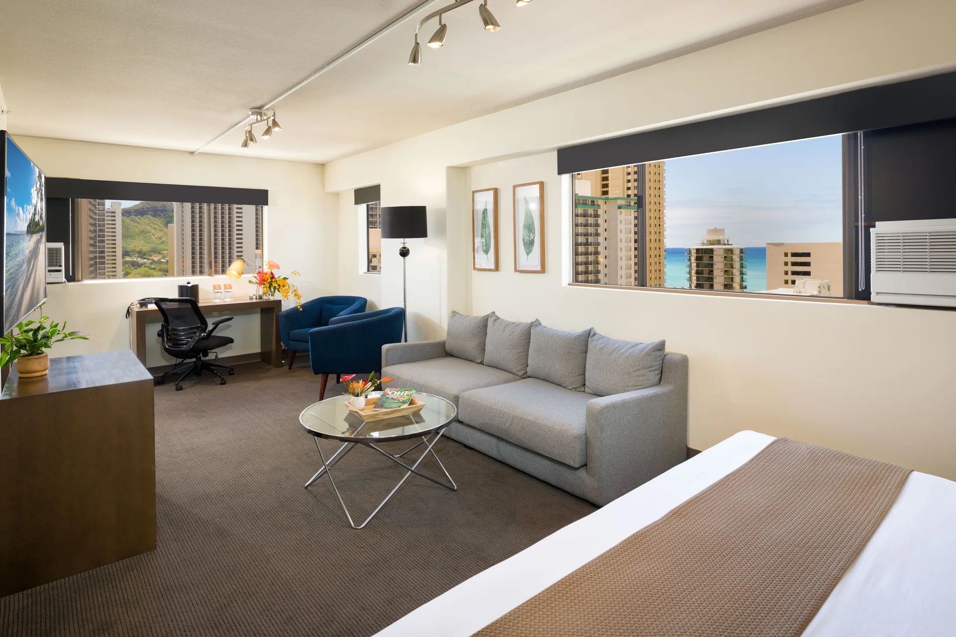 Lifestyle Jr. Suite with sofa bed and ocean view windows at Vive Hotel Waikiki.