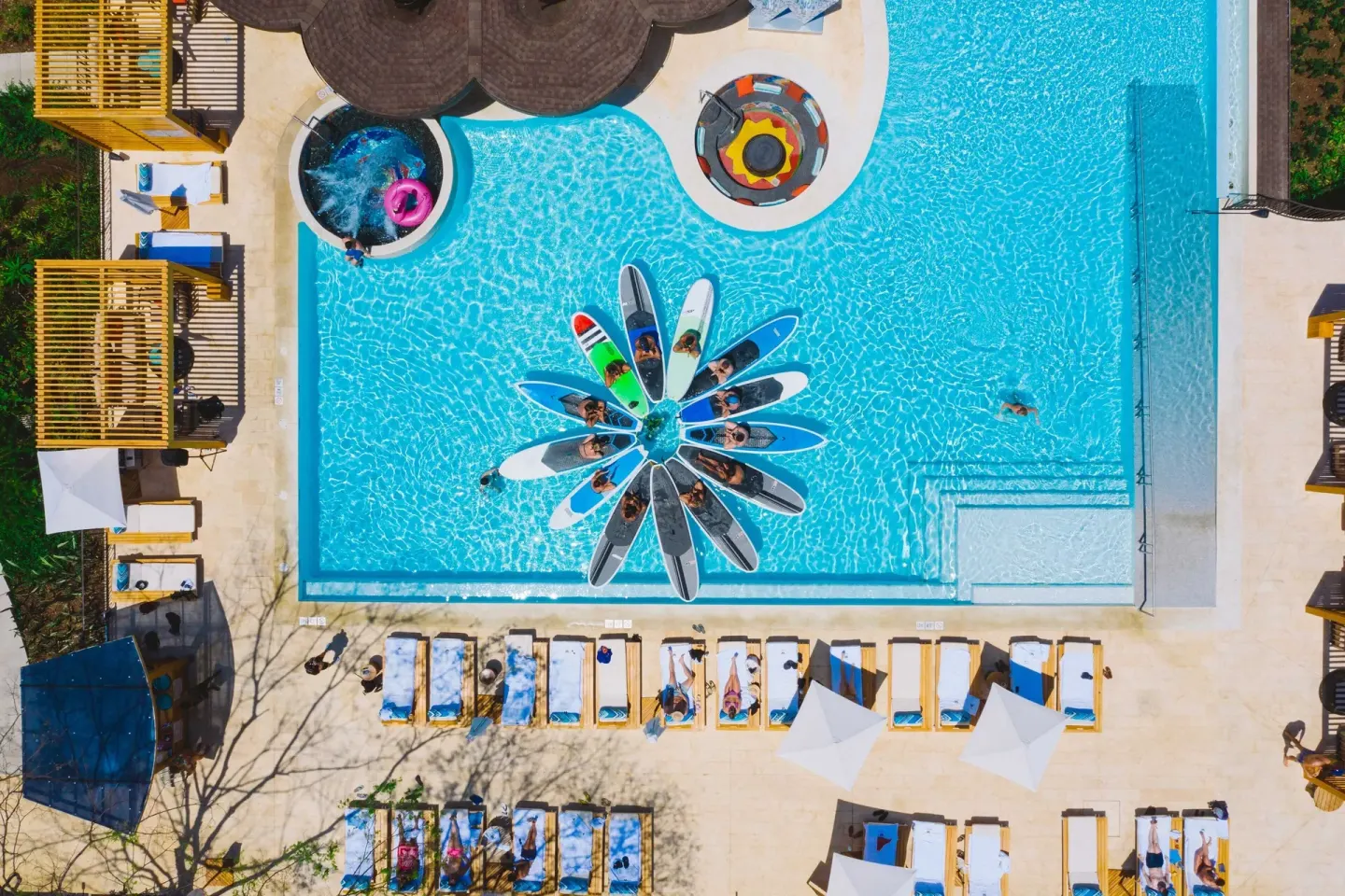 Aerial view of the resort pool with paddleboards at W Costa Rica - Reserva Conchal.
