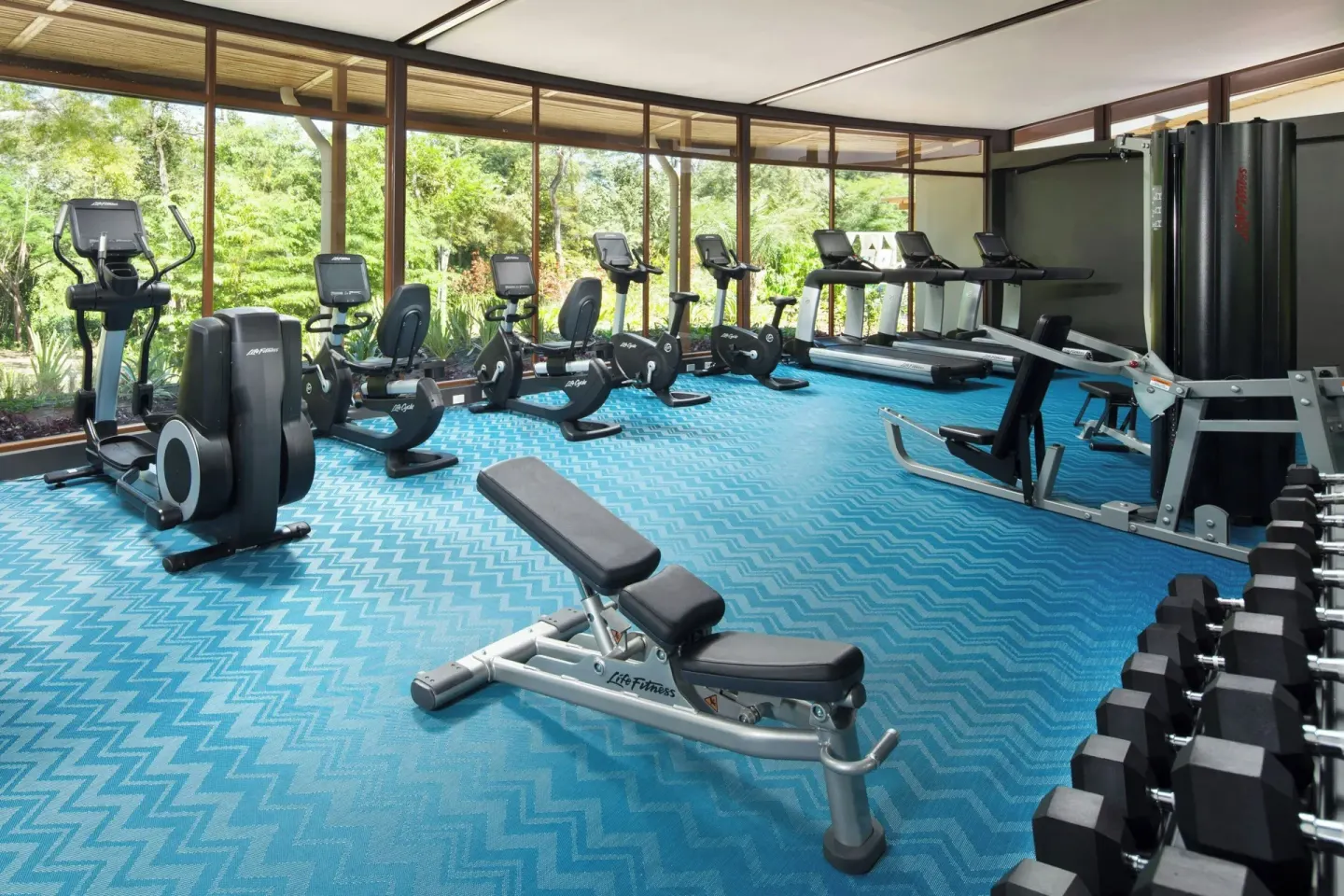 Fitness center with cardio machines and weights at W Costa Rica - Reserva Conchal.