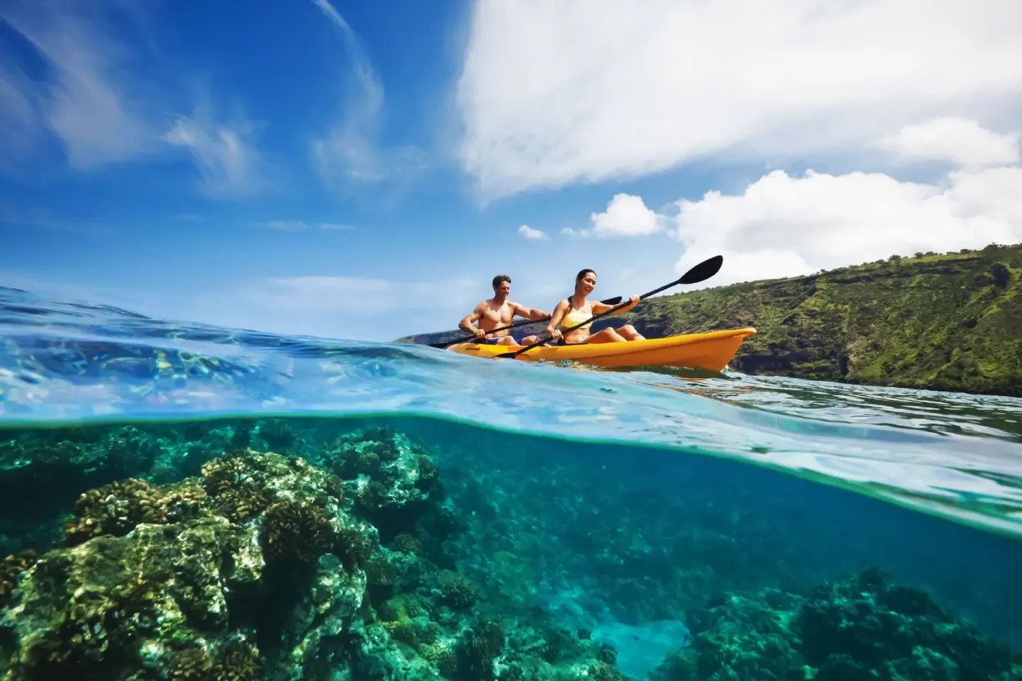 Kayakers on clear ocean water near W Costa Rica - Reserva Conchal.