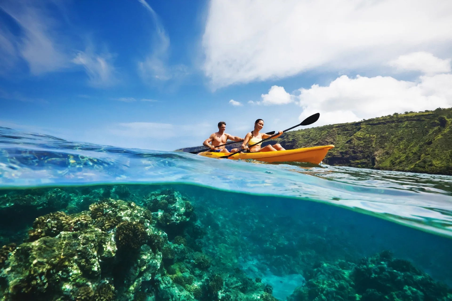 Kayakers on clear ocean water near W Costa Rica - Reserva Conchal.