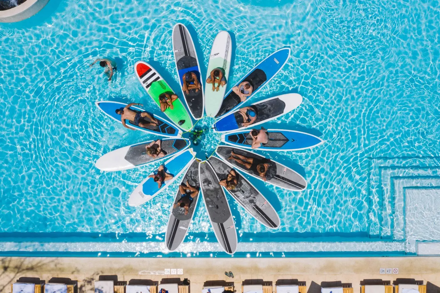 Guests on paddleboards in the pool at W Costa Rica - Reserva Conchal.
