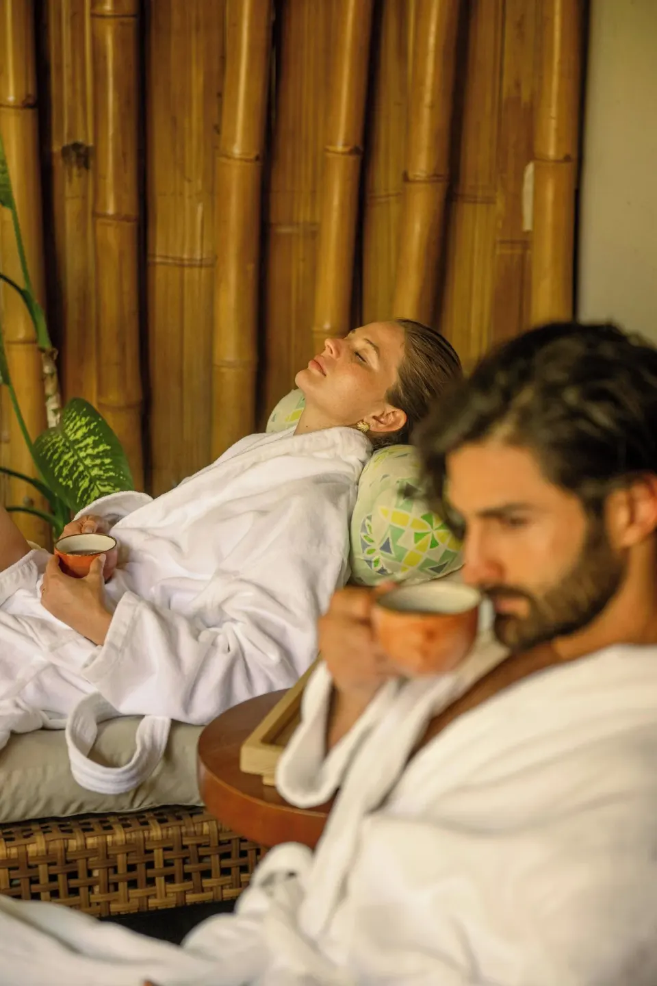 Guests in robes relaxing with tea at W Costa Rica - Reserva Conchal.