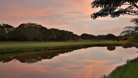 Sunset reflected in a resort lagoon at W Costa Rica - Reserva Conchal.