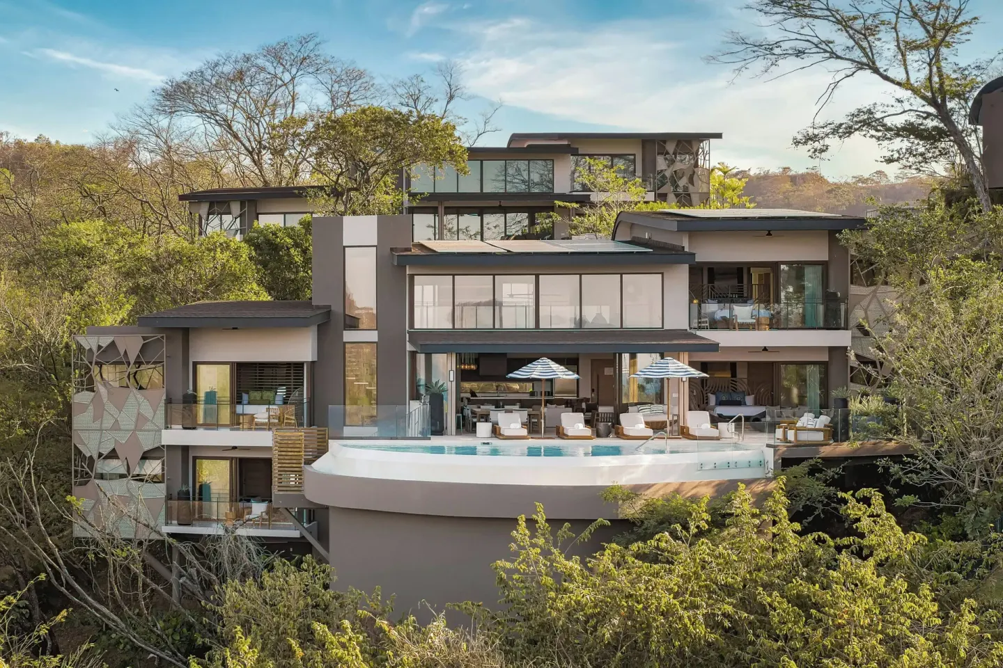 Four-bedroom residence exterior with pool deck at W Costa Rica - Reserva Conchal.