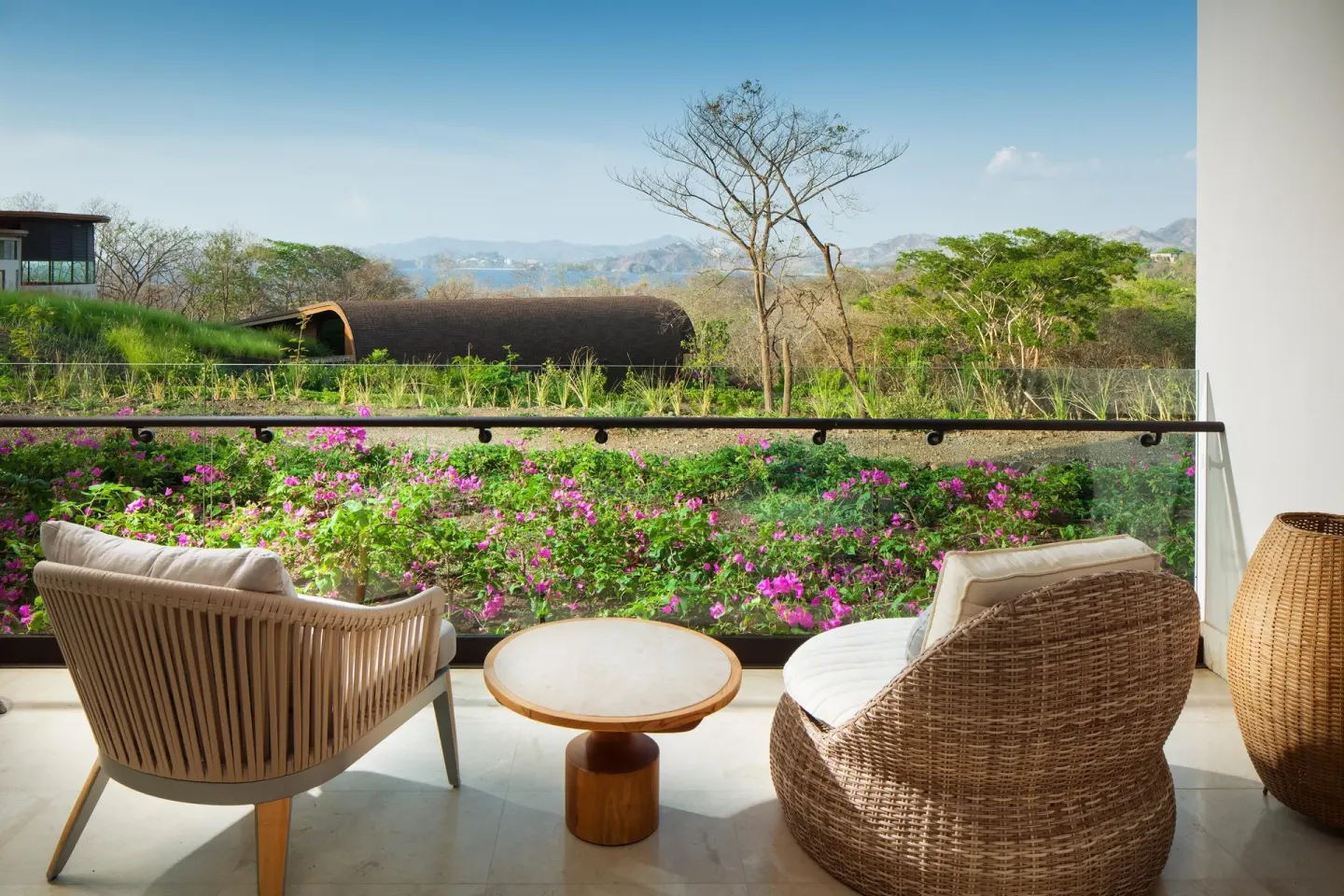 Garden-view balcony with lounge chairs at W Costa Rica - Reserva Conchal.