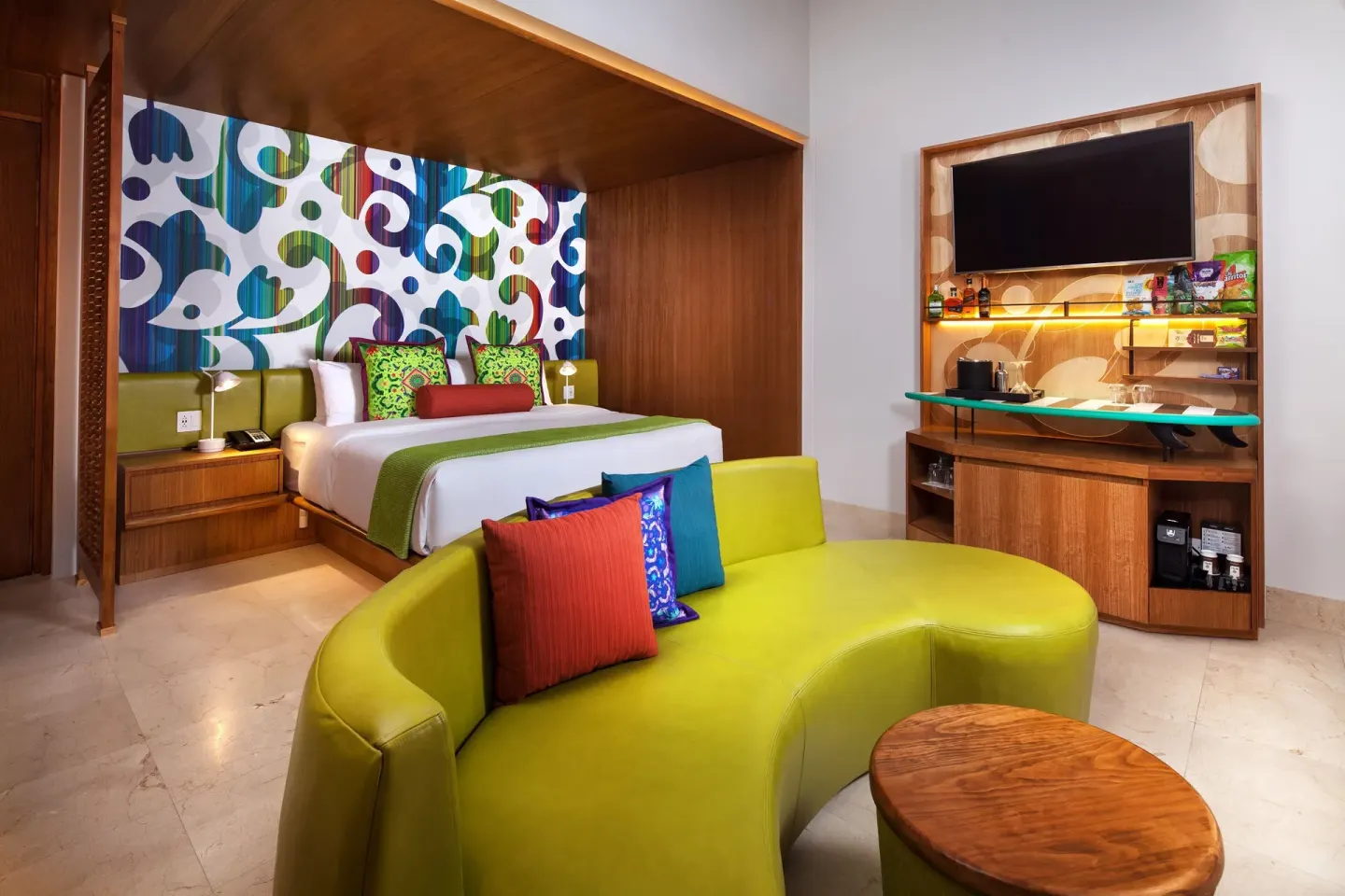 Standard Room one-bed interior with lounge seating at W Costa Rica - Reserva Conchal.