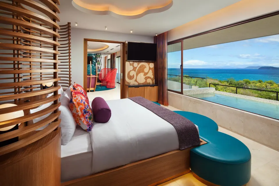 King bedroom in a Suite One Bedroom Balcony Ocean View at W Costa Rica - Reserva Conchal with ocean view.