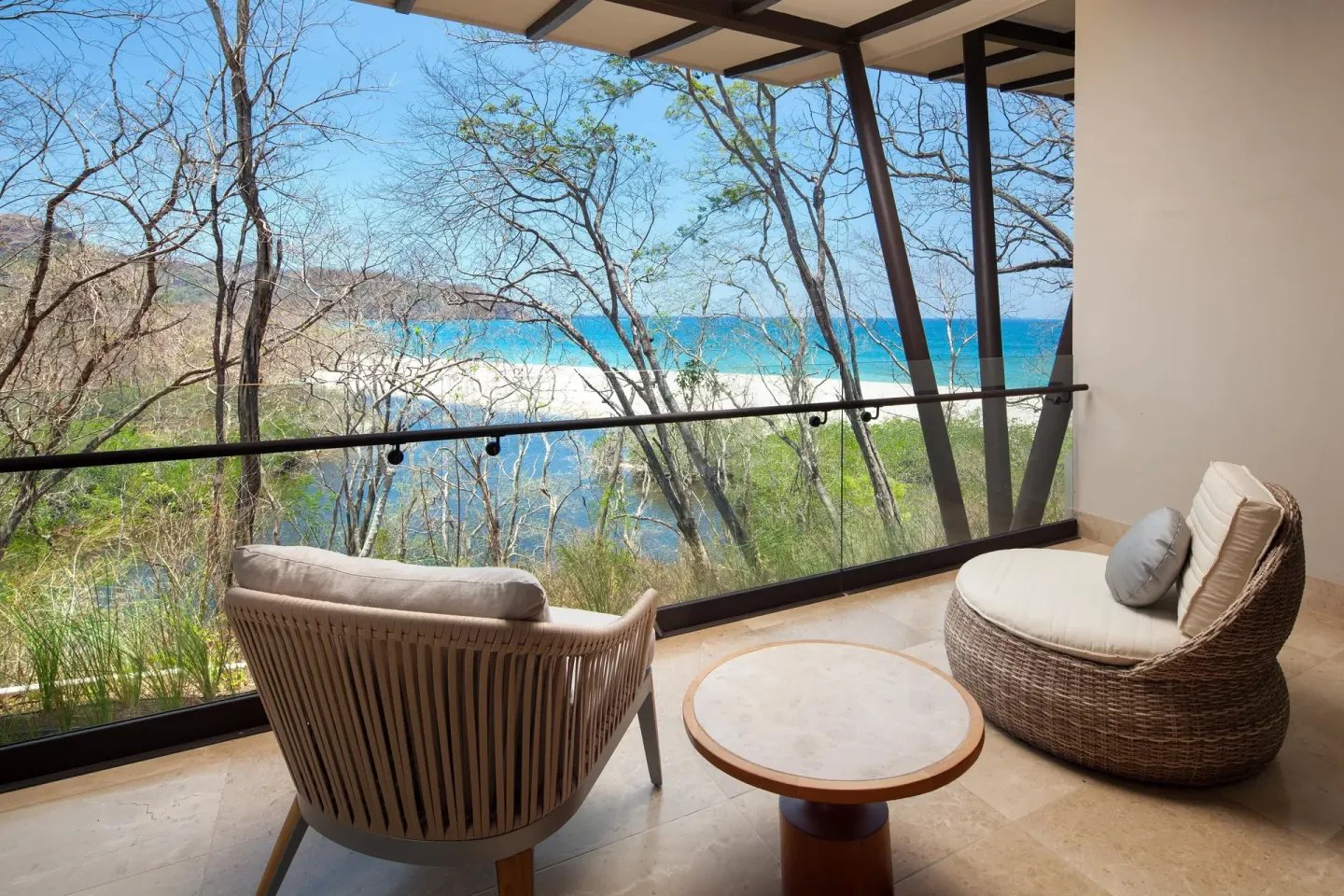 Superior Room balcony with chairs and ocean view at W Costa Rica - Reserva Conchal.