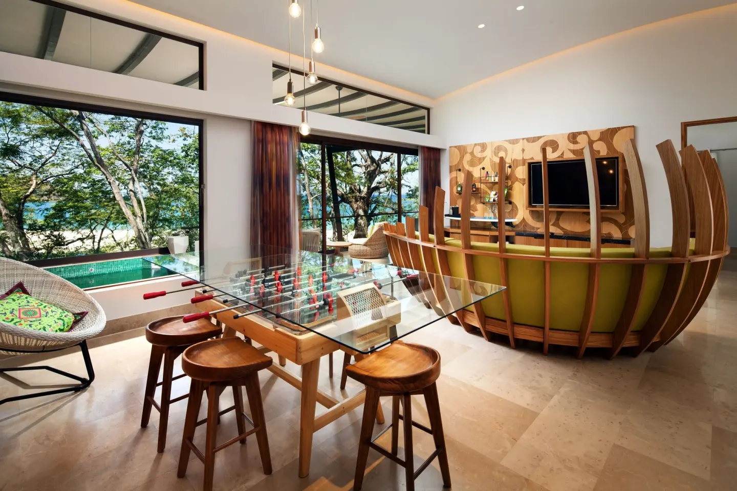 Superior Suite living area with foosball table at W Costa Rica - Reserva Conchal.