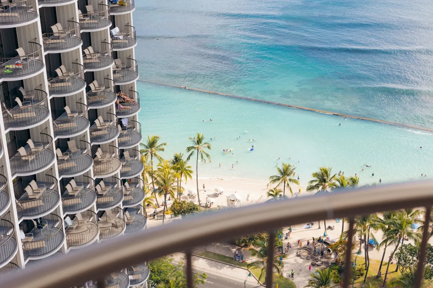 A balcony view overlooks Waikiki Beach Marriott Resort & Spa and ocean at Waikiki Beach Marriott Resort & Spa.