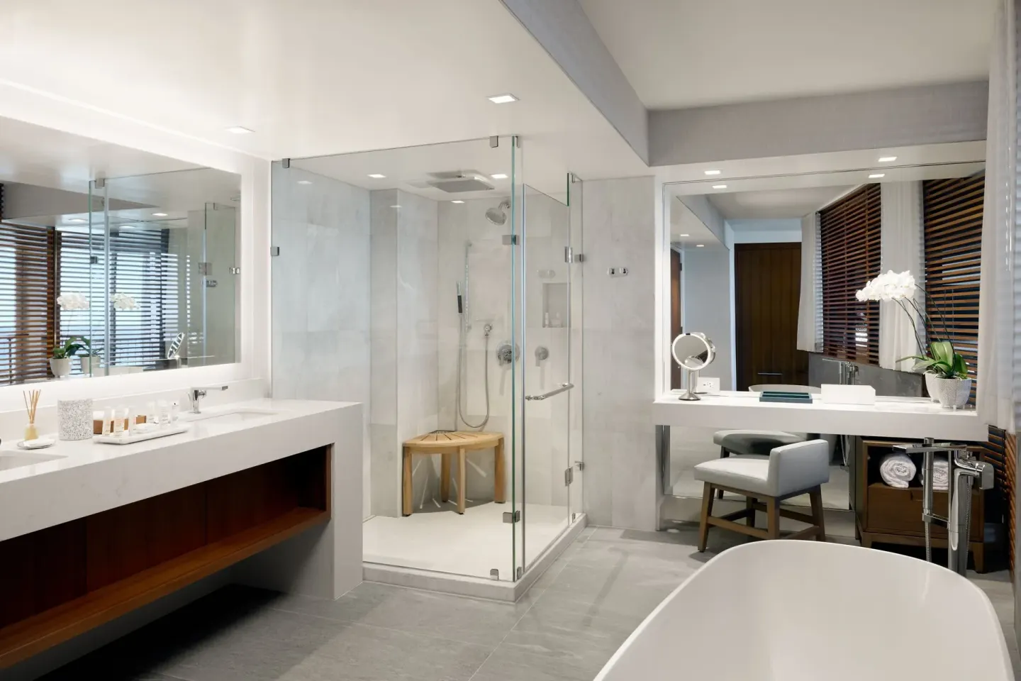Modern bathroom with glass shower and vanity area at Waikiki Beach Marriott Resort & Spa.