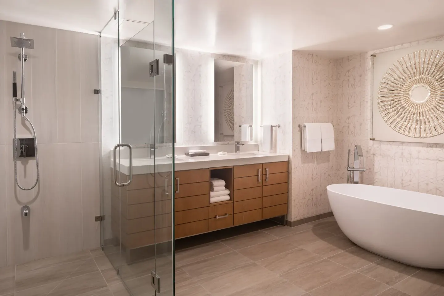 Spacious bathroom with glass shower and soaking tub at Waikiki Beach Marriott Resort & Spa.
