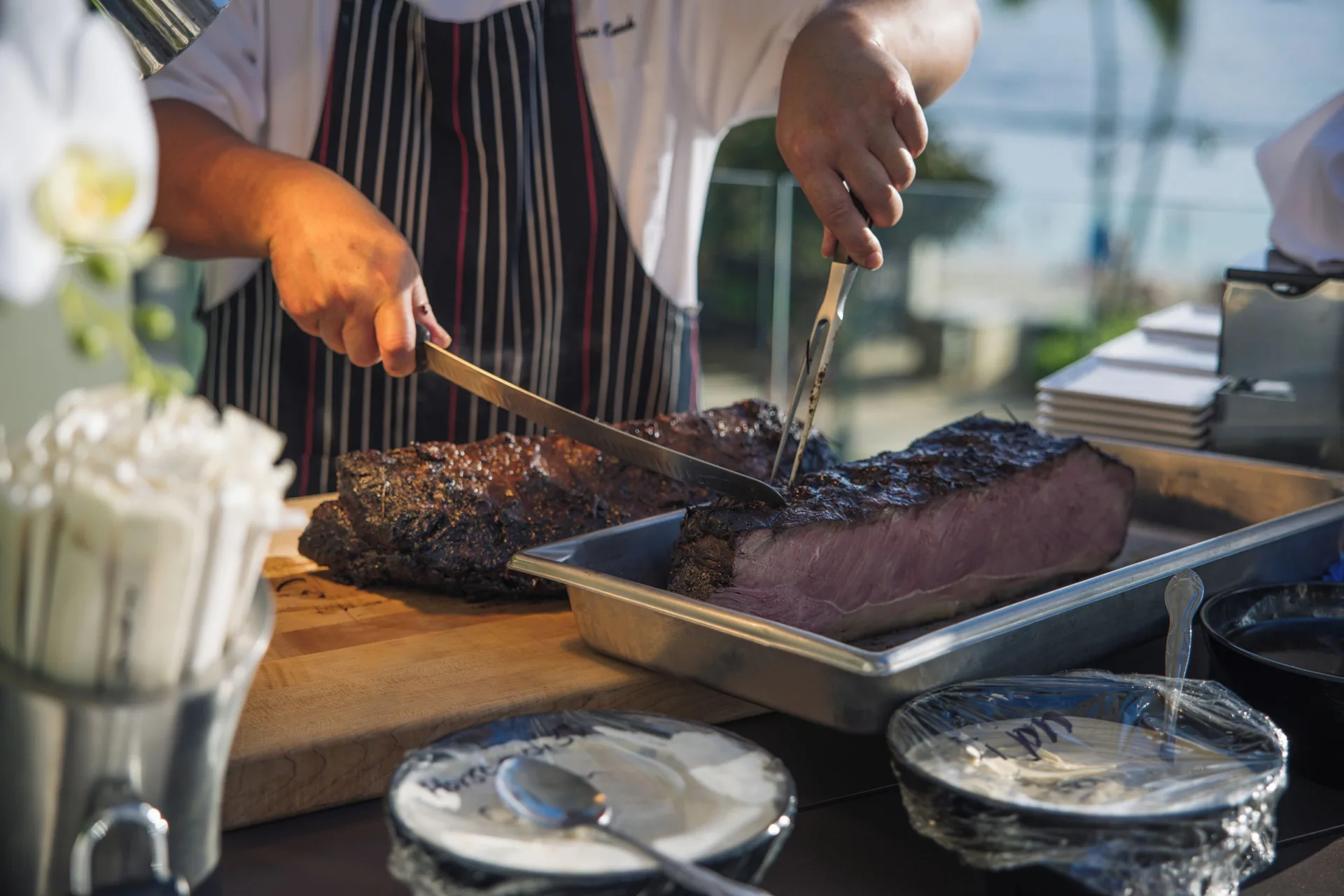 Chef carving grilled meat at Waikiki Beach Marriott Resort & Spa.