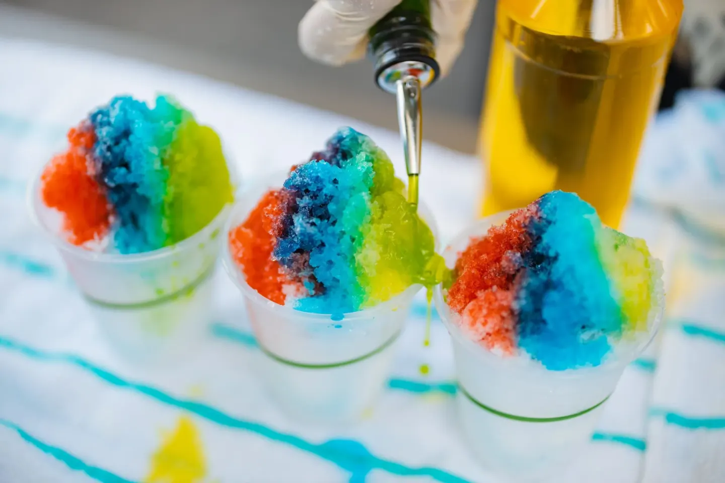 Colorful shave ice cups are topped with syrup at Waikiki Beach Marriott Resort & Spa.