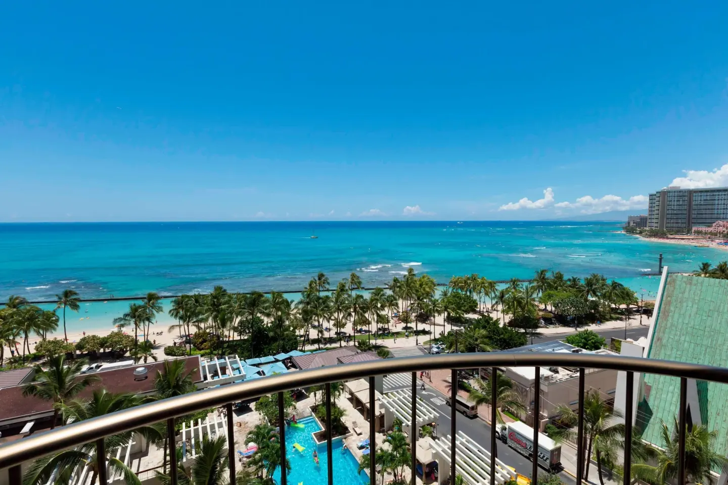 Balcony view of Waikiki Beach Marriott Resort & Spa and turquoise ocean at Waikiki Beach Marriott Resort & Spa.