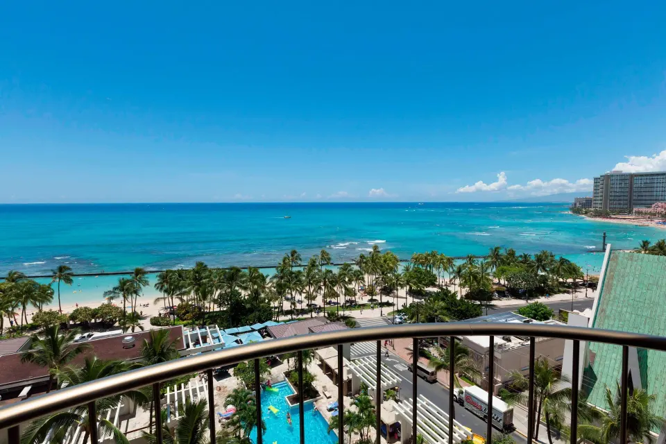 Balcony view of Waikiki Beach Marriott Resort & Spa and turquoise ocean at Waikiki Beach Marriott Resort & Spa.